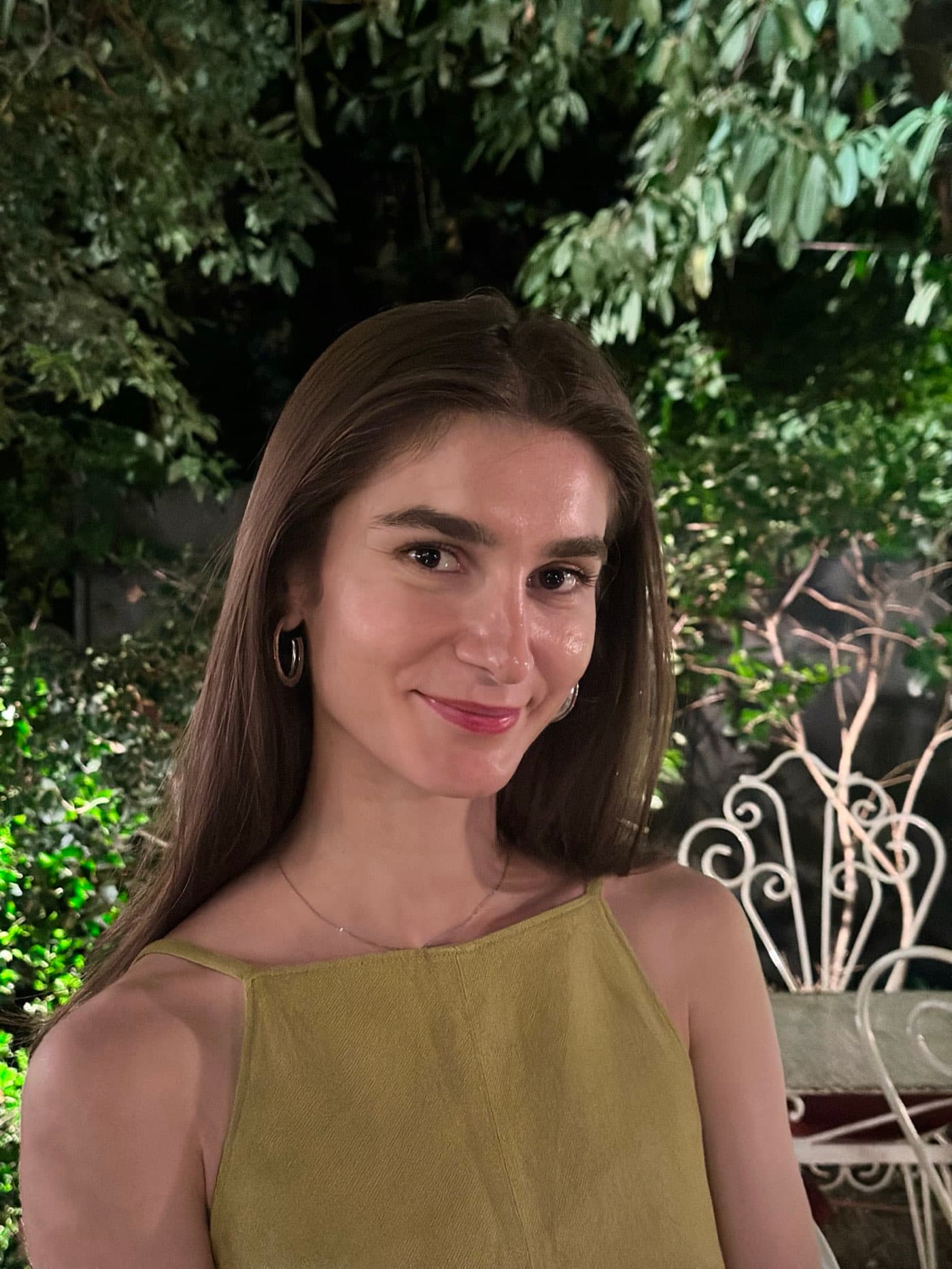 Elena Petrescu, Ayla Femme's ambassador, smiling in a garden