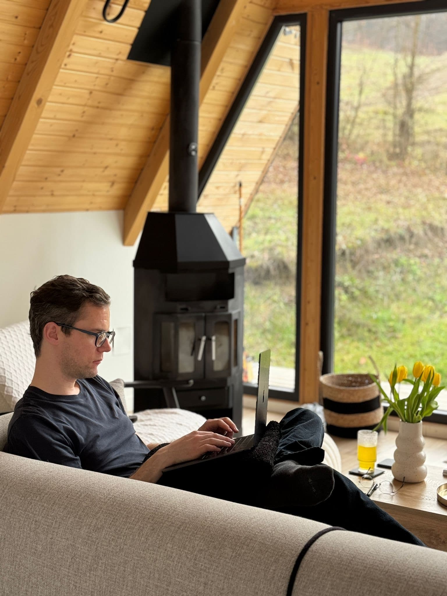 François, Ayla's founder, working on a laptop in a calm wood-panelled room